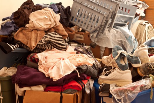 Professional team sorting office items for clearance